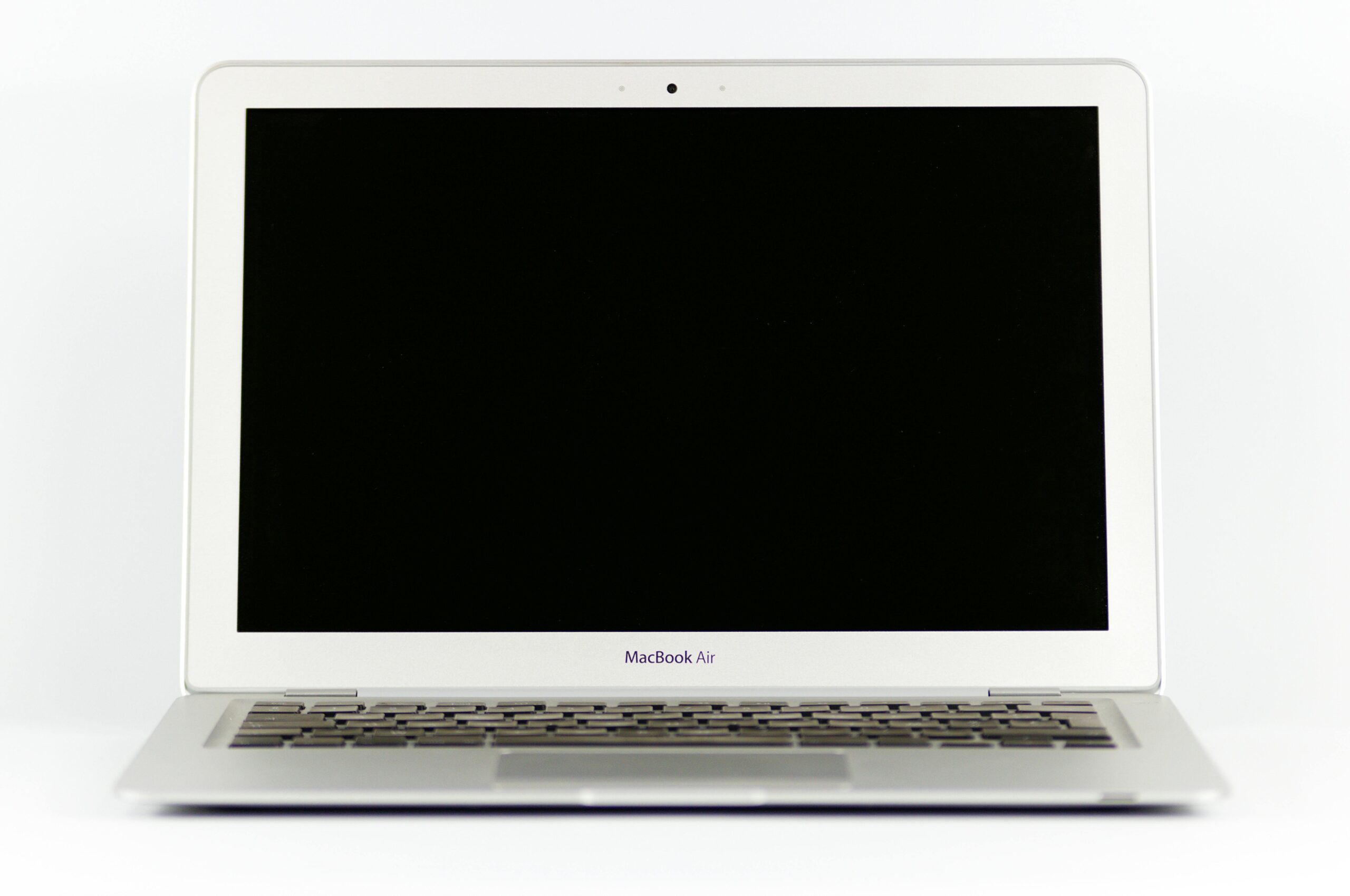 Front view of a MacBook Air laptop with a blank screen on a white background.
